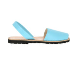 Light blue leather sandal with a black sole for women shown in profile