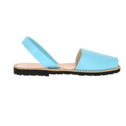 Light blue leather sandal with a black sole for women shown in profile