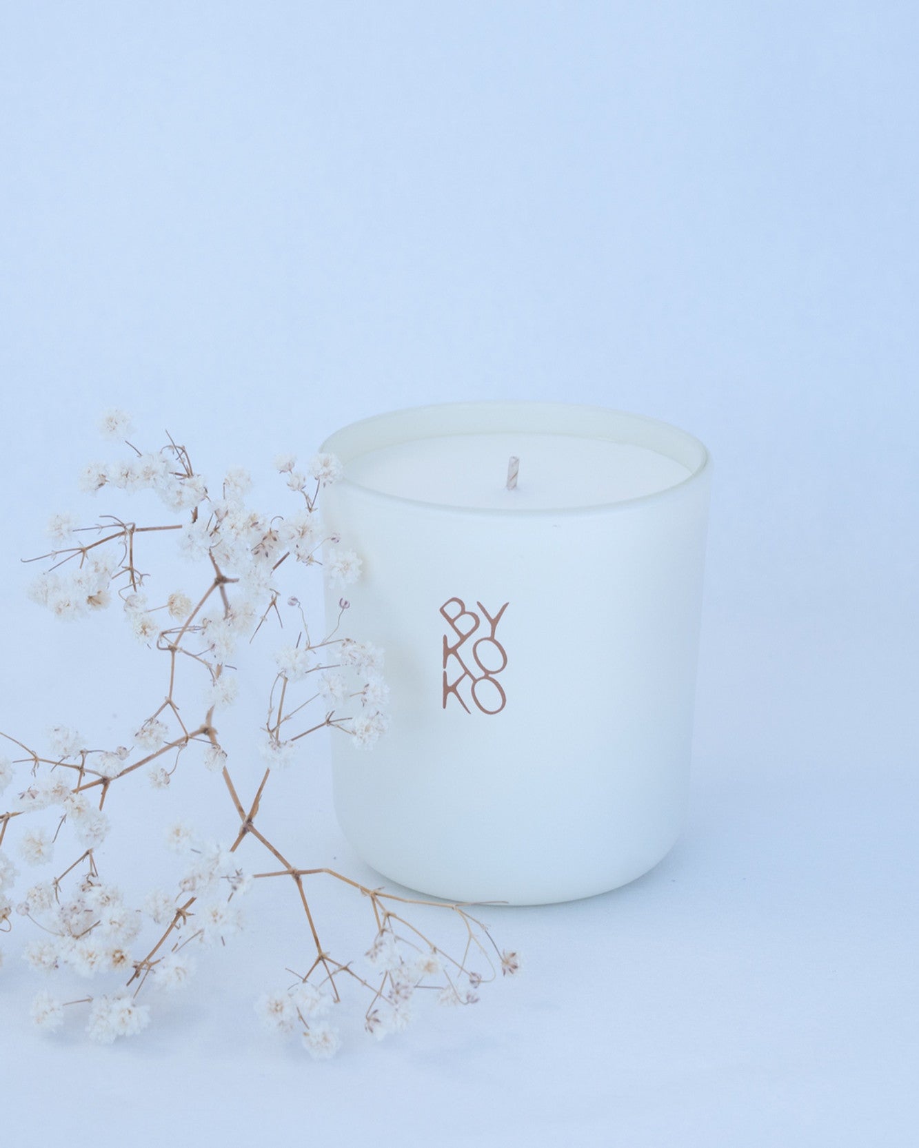 BYKOKO Edelweiss Bloom scented candle styled with dried flowers