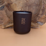 BYKOKO Havana Lovers scented candle on a wooden backdrop