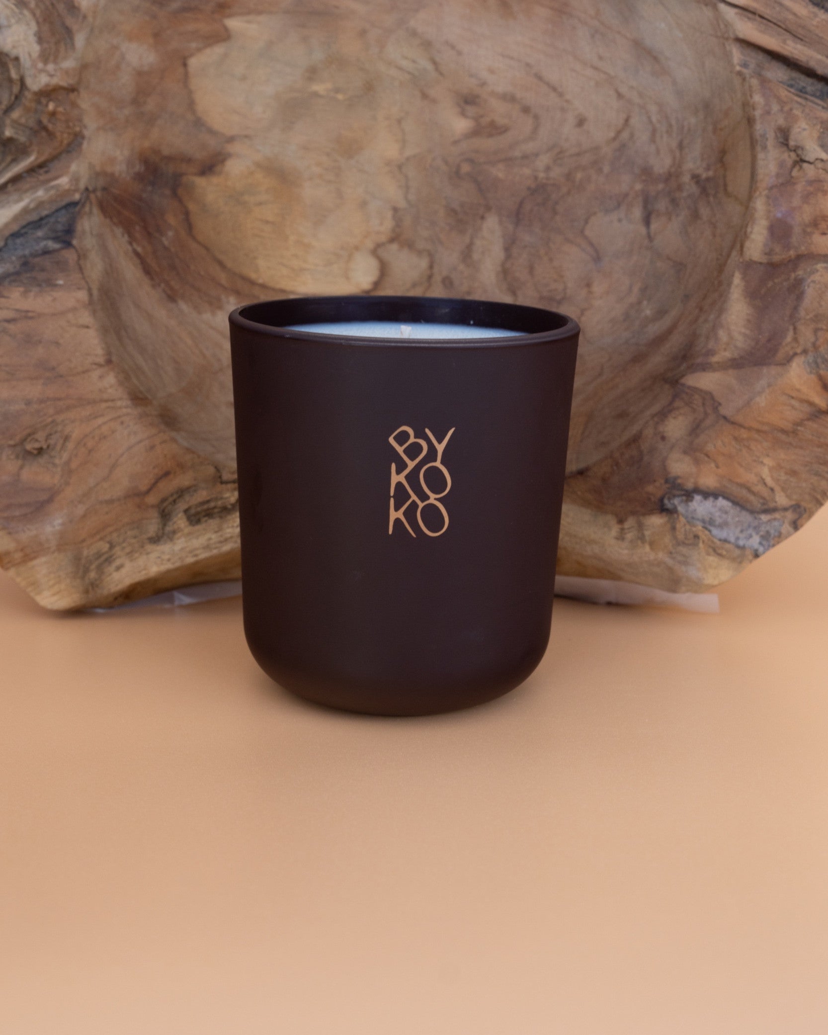 BYKOKO Havana Lovers scented candle on a wooden backdrop