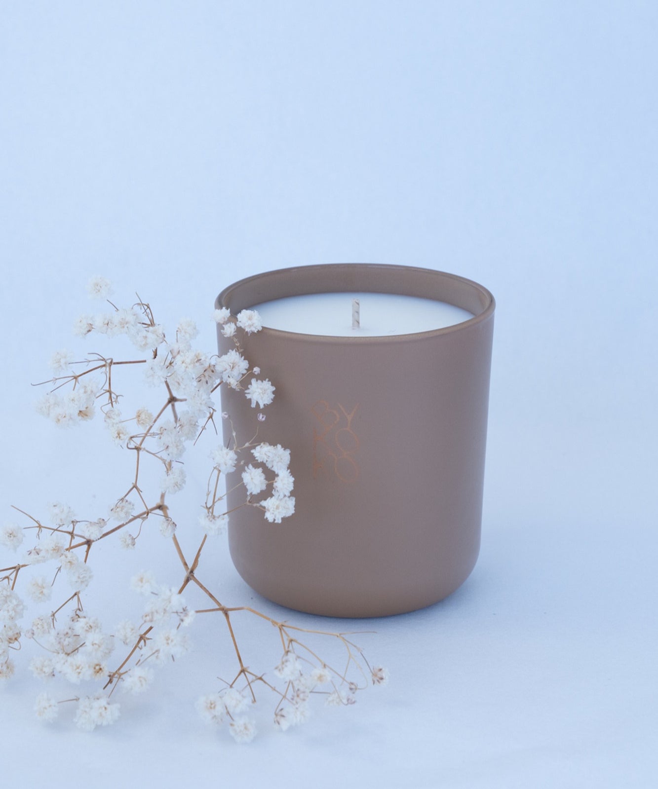 BYKOKO Noble Leather scented candle styled with dried flowers