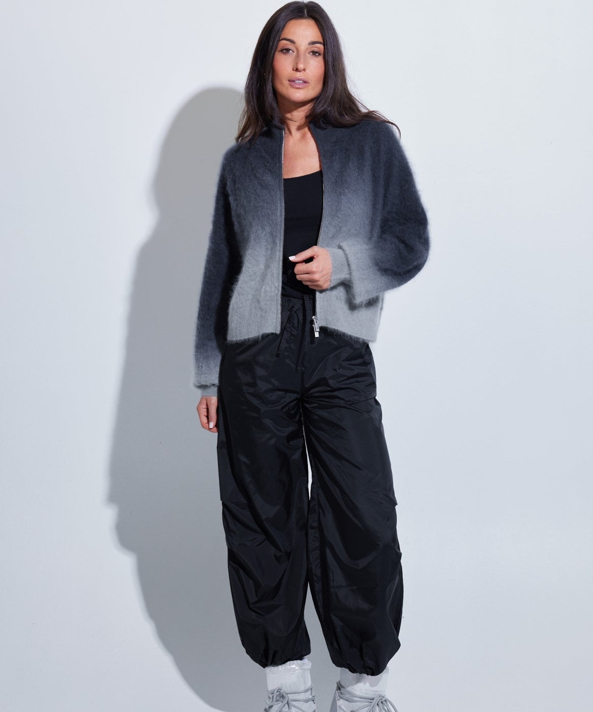 Model wearing the C~RUSH Dip Toto zip jacket in grey ombré with black trousers