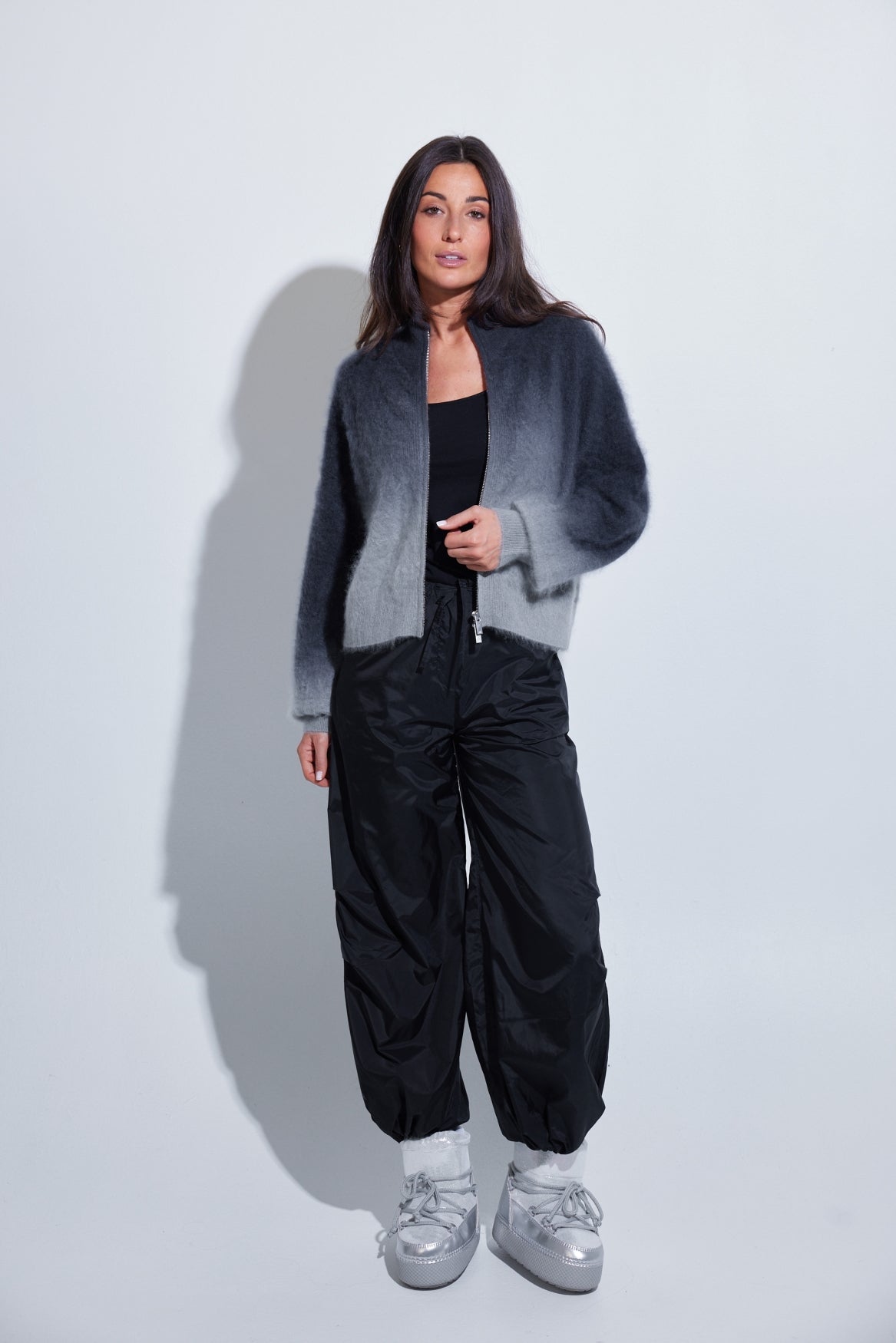Model wearing the C~RUSH Dip Toto zip jacket in grey ombré with black trousers