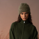 COLORUSH Byron cashmere beanie in Kiwi, worn from the front with a green zip jacket