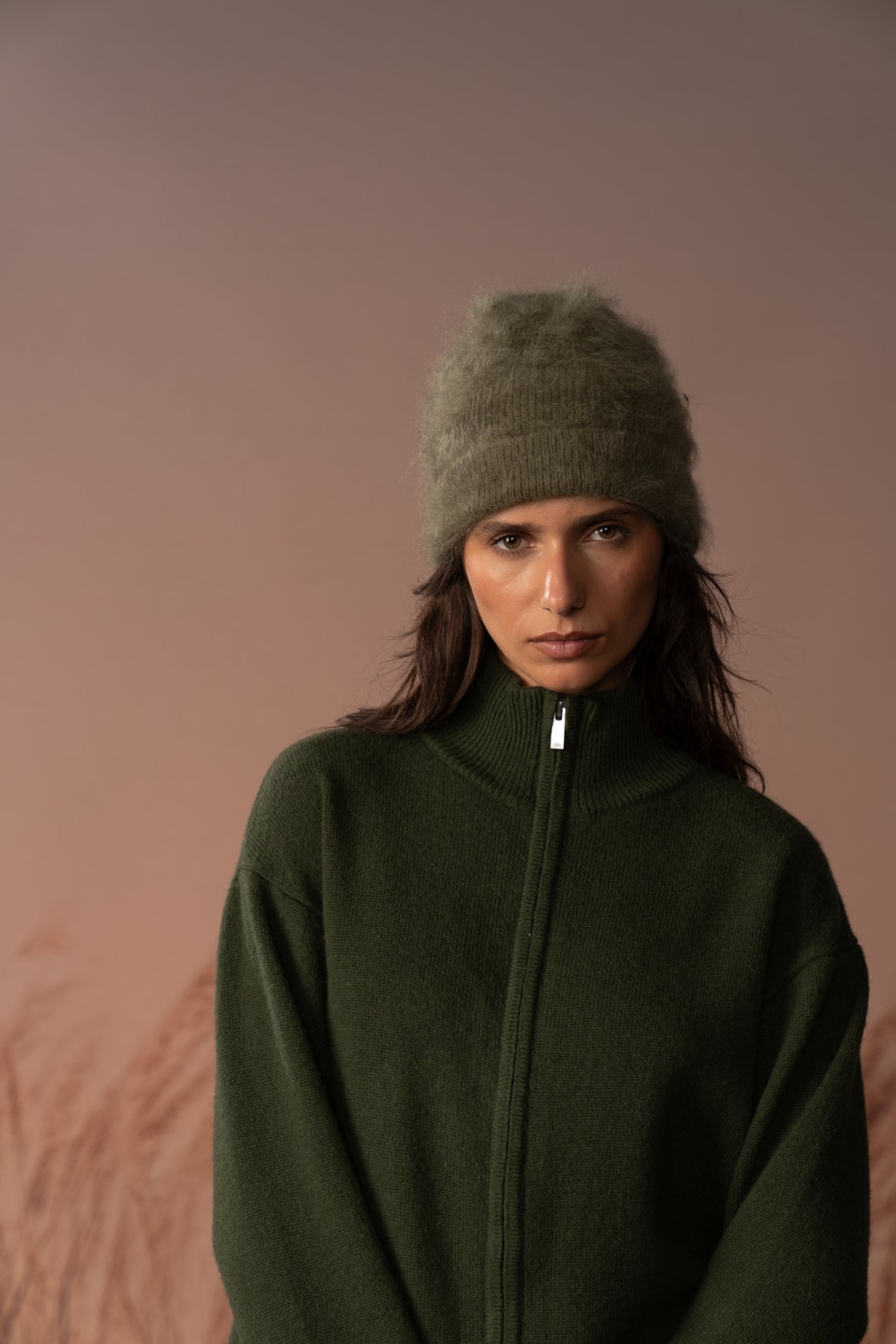 COLORUSH Byron cashmere beanie in Kiwi, worn from the front with a green zip jacket