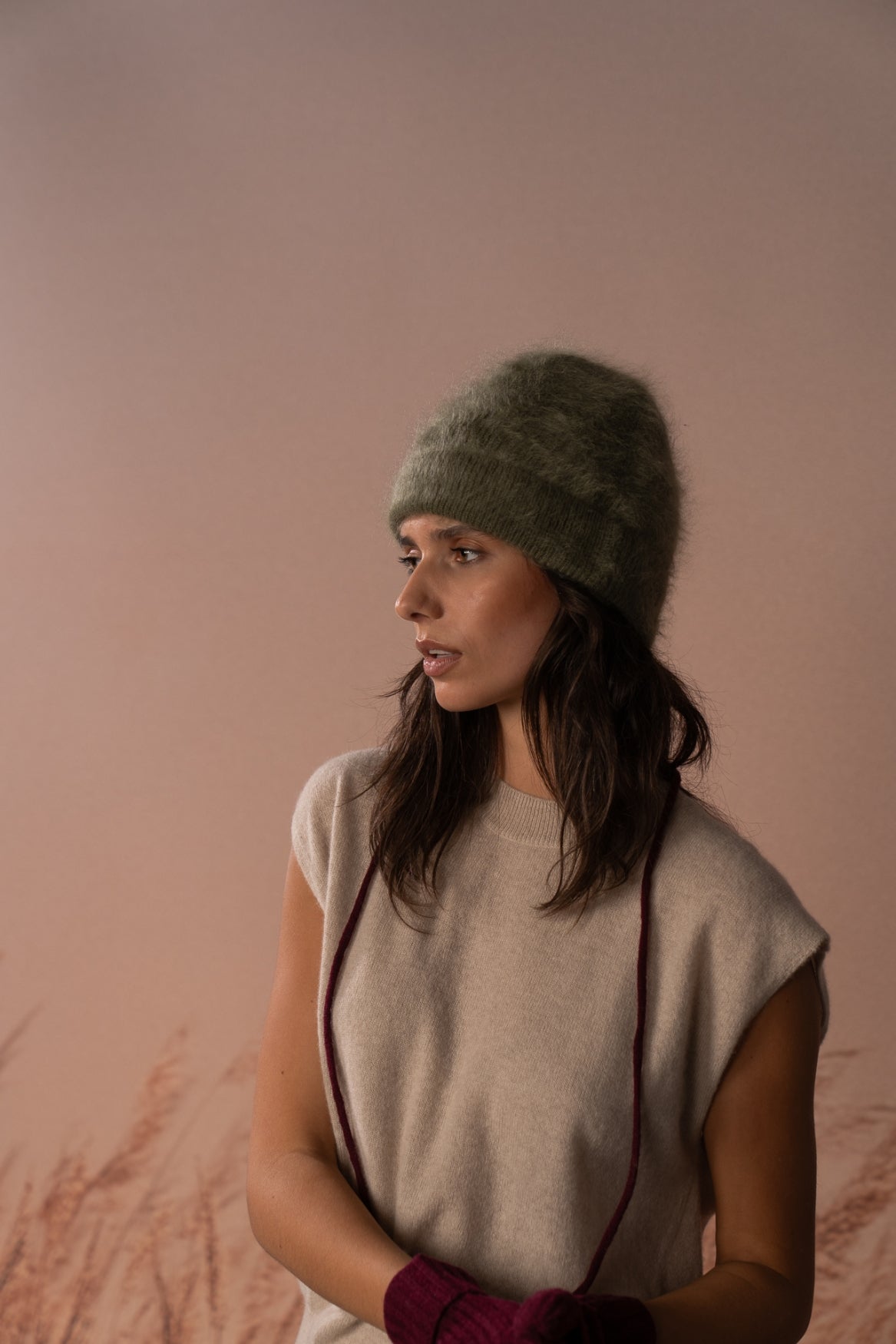 COLORUSH Byron beanie in Kiwi, side view with a beige knit top