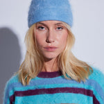 COLORUSH Byron beanie in Stonewash, worn with a multicoloured striped jumper