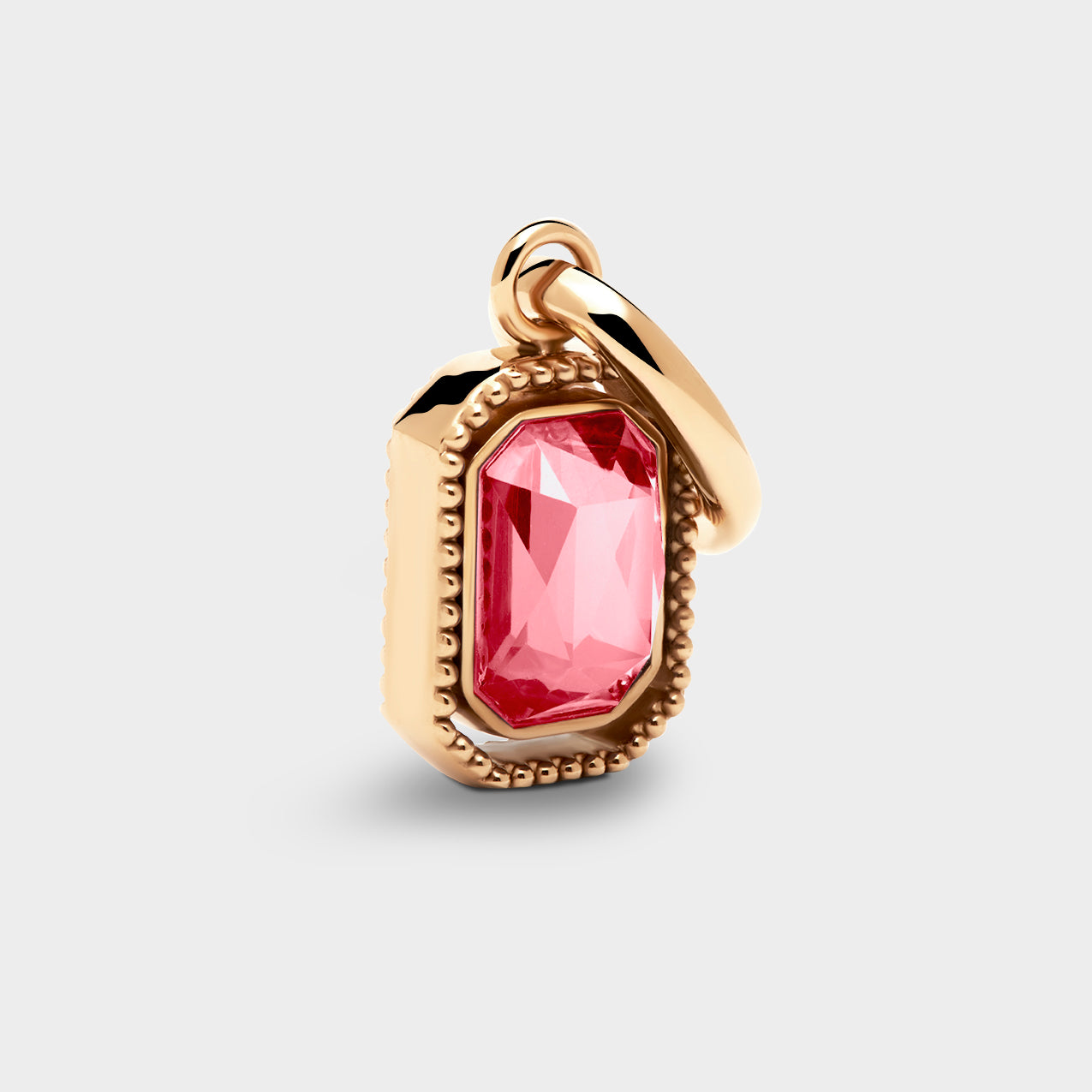 Coluri Talisman charm with a rose pink stone in a gold setting