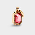 Coluri Talisman charm with a rose pink stone in a gold setting