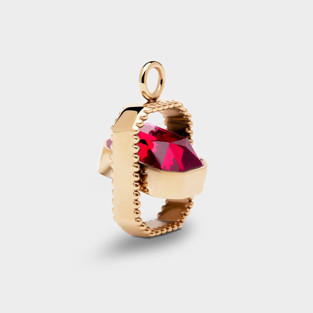 Coluri Talisman charm with a scarlet stone in gold, side view