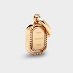 Coluri Talisman charm with a snow-white stone in gold, back view