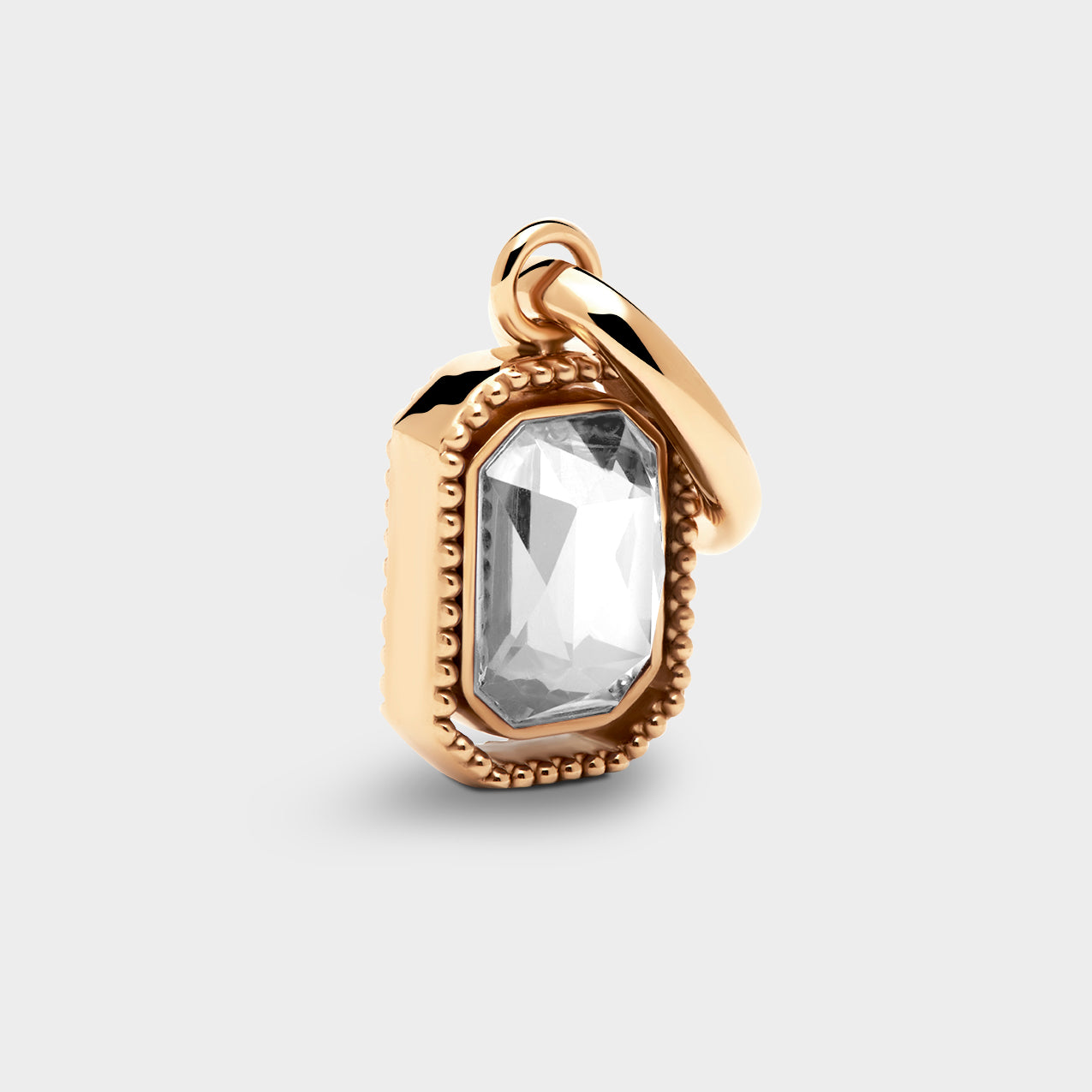 Coluri Talisman charm with a snow-white stone in gold, front view