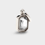 Coluri Talisman charm with a snow-white stone in silver, front view