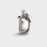 Coluri Talisman charm with a snow-white stone in silver, front view
