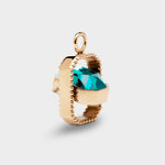 Coluri Talisman charm with a turquoise stone in a gold setting – side view