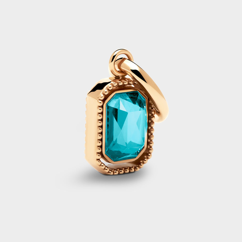 Coluri Talisman charm with a turquoise stone in a gold setting