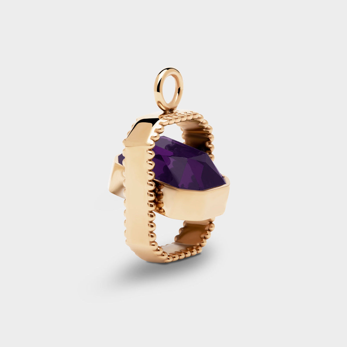 Coluri Talisman charm with a violet stone in gold, side view
