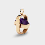Coluri Talisman charm with a violet stone in gold, side view