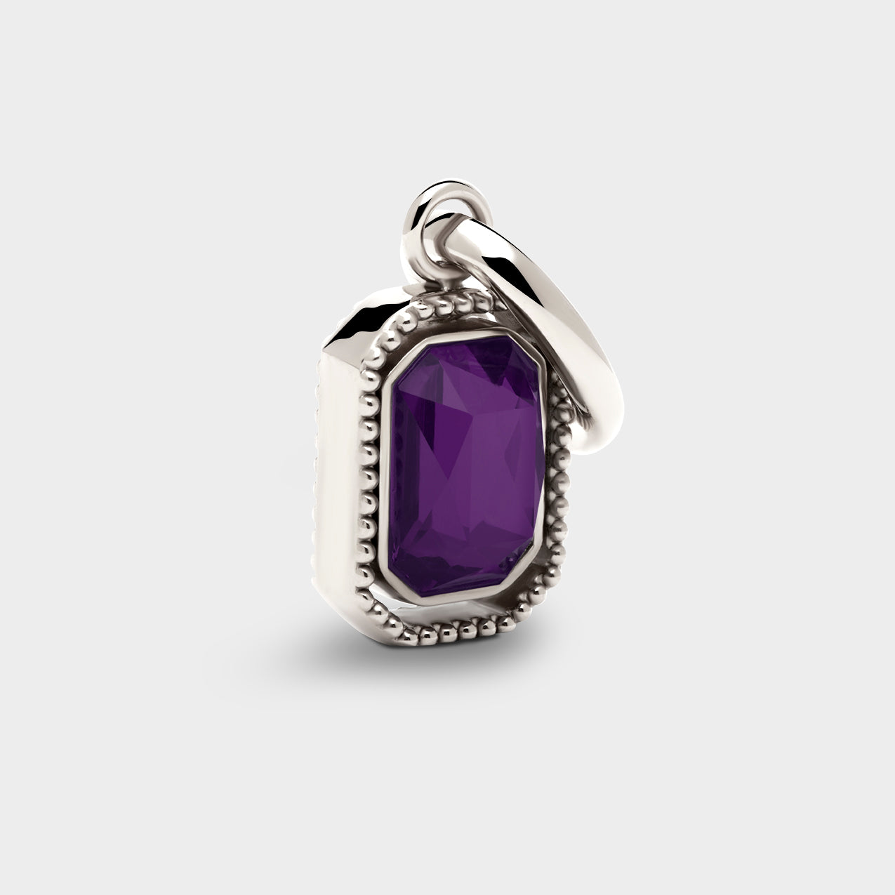 Coluri Talisman charm with a violet stone in silver, front view
