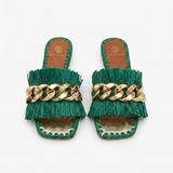 De Siena Saffia flat slide sandals in dark green with a fringed strap and chunky gold-tone chain