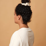Emily's Pillow large pure silk scrunchie in champagne worn in a high bun