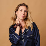 Woman wearing the Emily's Pillow large pure silk scrunchie in mocha