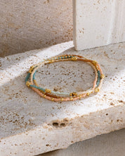 Stackable and versatile, the Miyuki Beaded Stretch Bracelet Trio in Peach Aqua Turquoise by Mayana Designs
