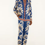 Full-length front view of a model wearing the Farm Rio Blue Luna pajama pants with a relaxed wide-leg cut and botanical print.
