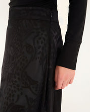 Close-up detail view of the Farm Rio maxi skirt, highlighting the embossed midnight leopard motif and the integrated invisible zipper at the side seam.