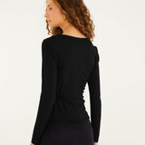 Back view of the FARM Rio black long-sleeved jersey blouse, smooth fitted back