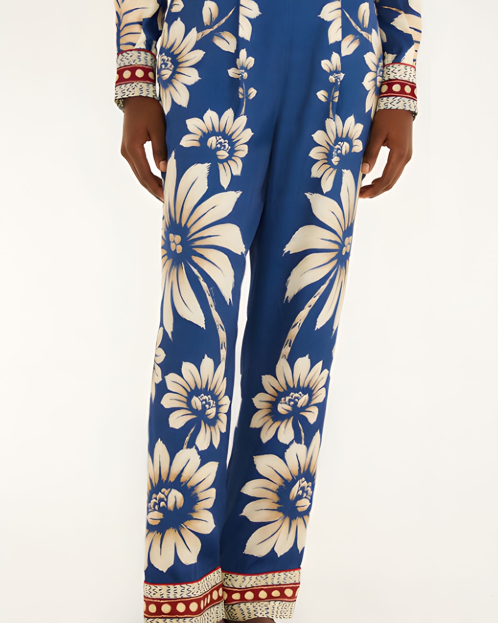 Close-up view of the Farm Rio Blue Luna pajama pants, highlighting the flowing wide-leg hem and contrast printed borders.