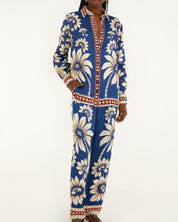 Full-length front view of a model wearing the Farm Rio Blue Luna pajama pants with a relaxed wide-leg cut and botanical print.