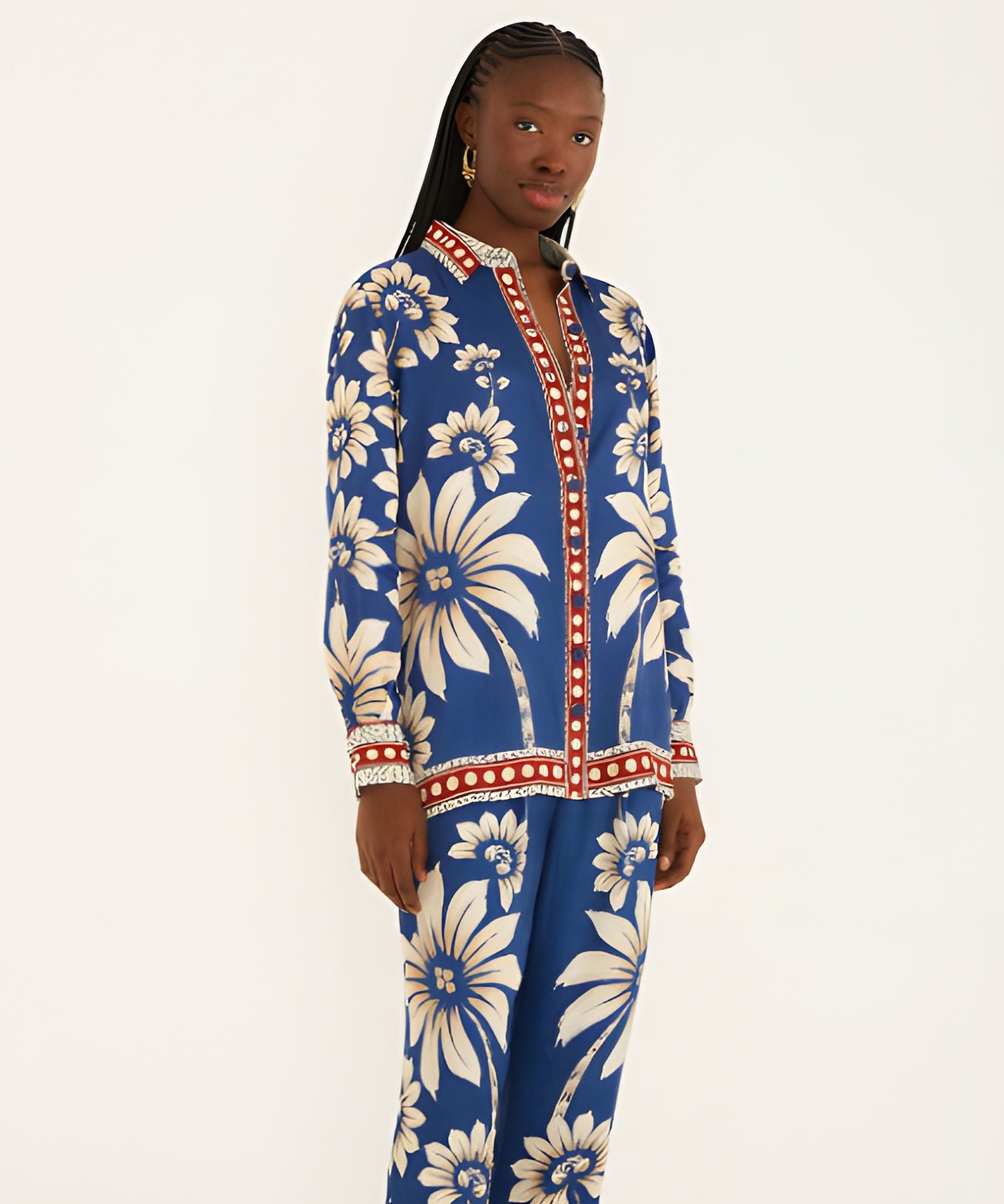 Side view of a model in a studio showcasing the relaxed, airy silhouette of the Farm Rio blue patterned pajama shirt.