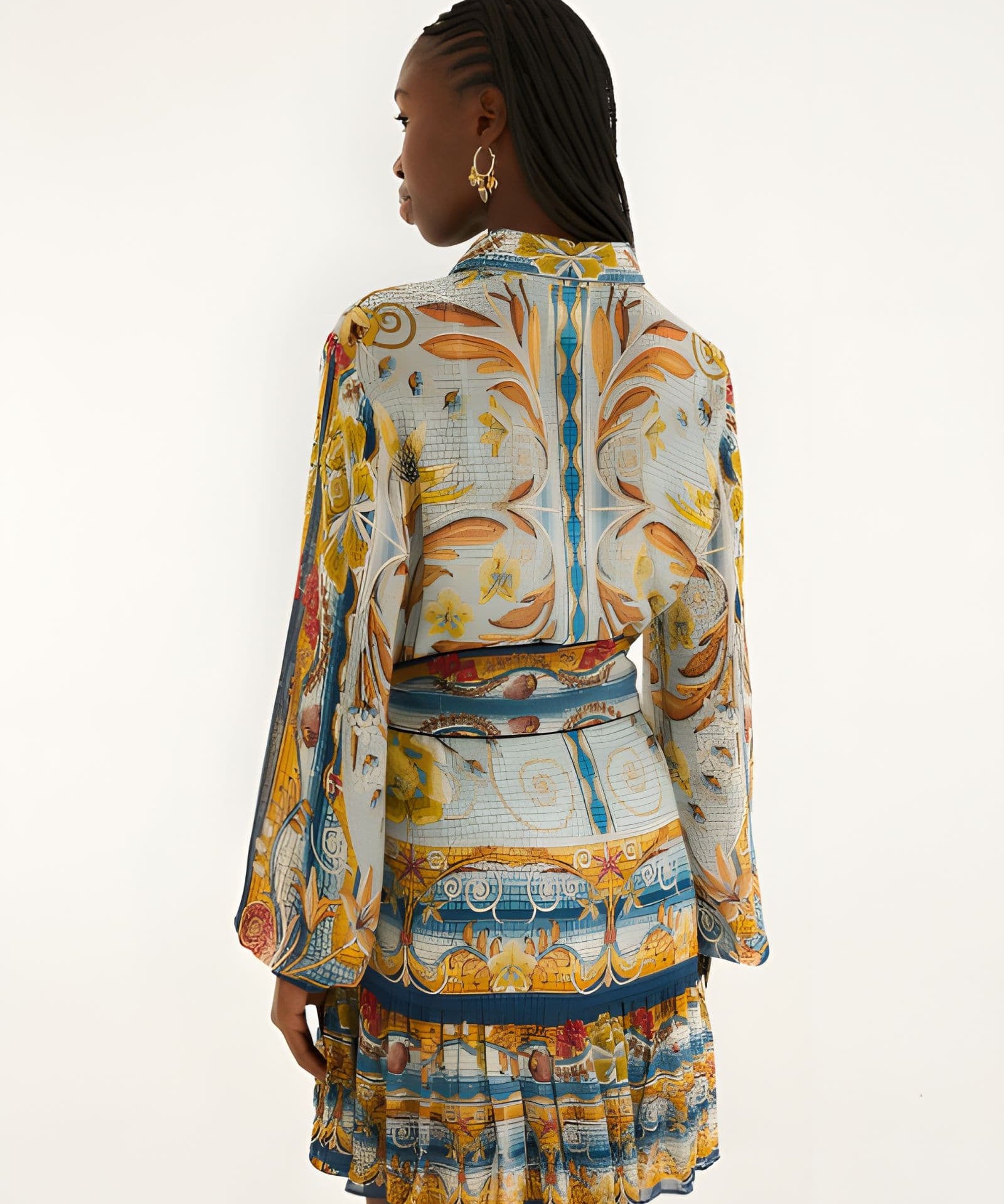 Back view of a model in a studio showcasing the relaxed fit and vibrant mosaic print of the Farm Rio mini dress.