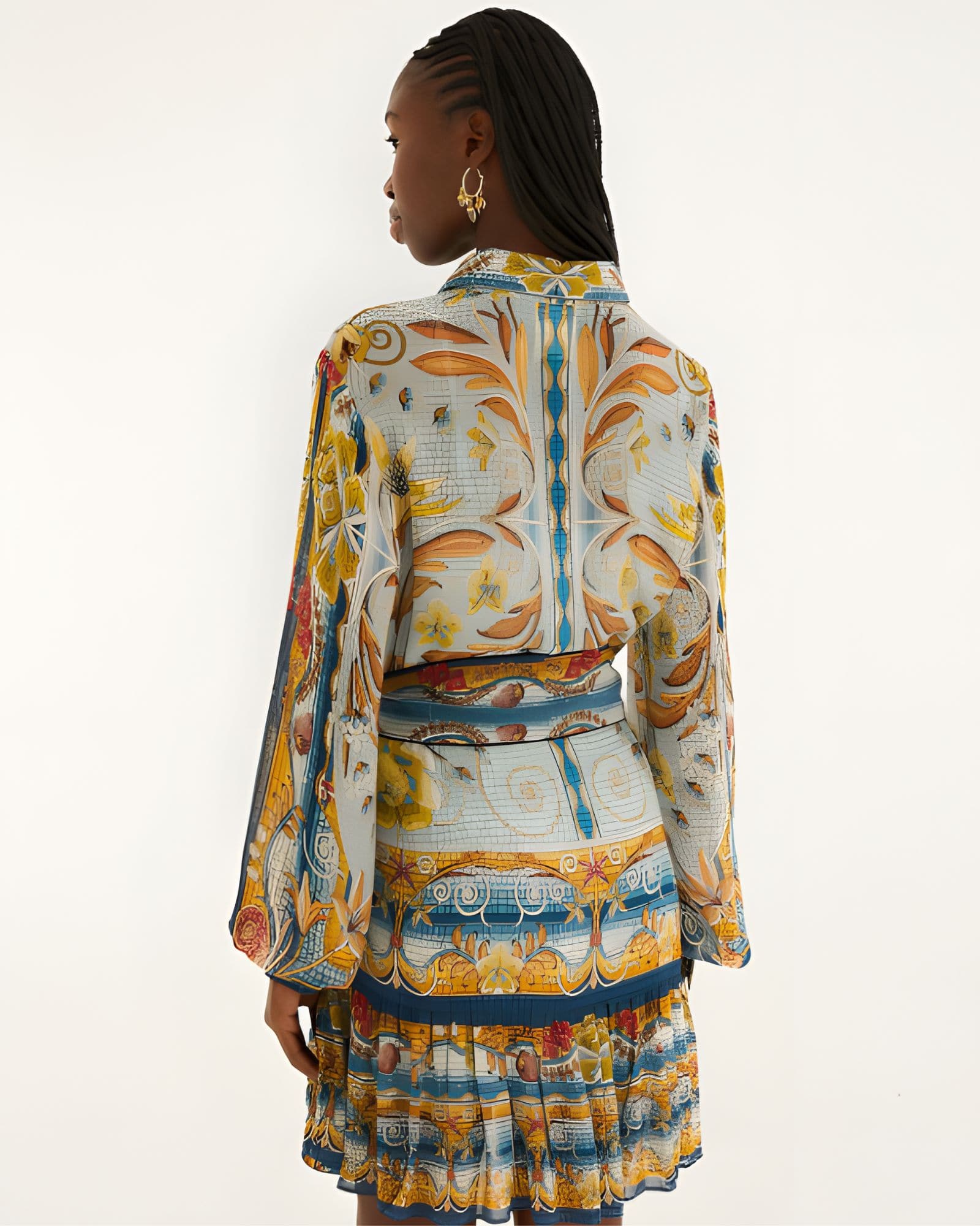 Back view of a model in a studio showcasing the relaxed fit and vibrant mosaic print of the Farm Rio mini dress.