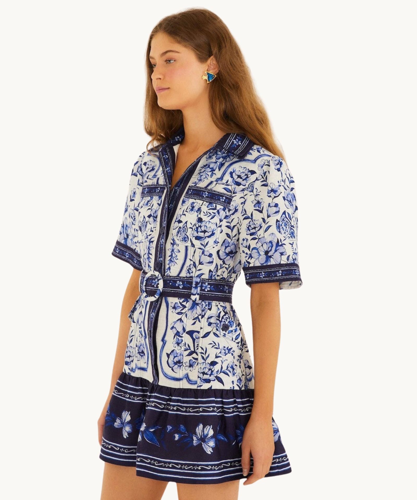 Side view of the FARM Rio Blue Porcelain Garden mini shirt dress showing the relaxed short sleeves and belted waist