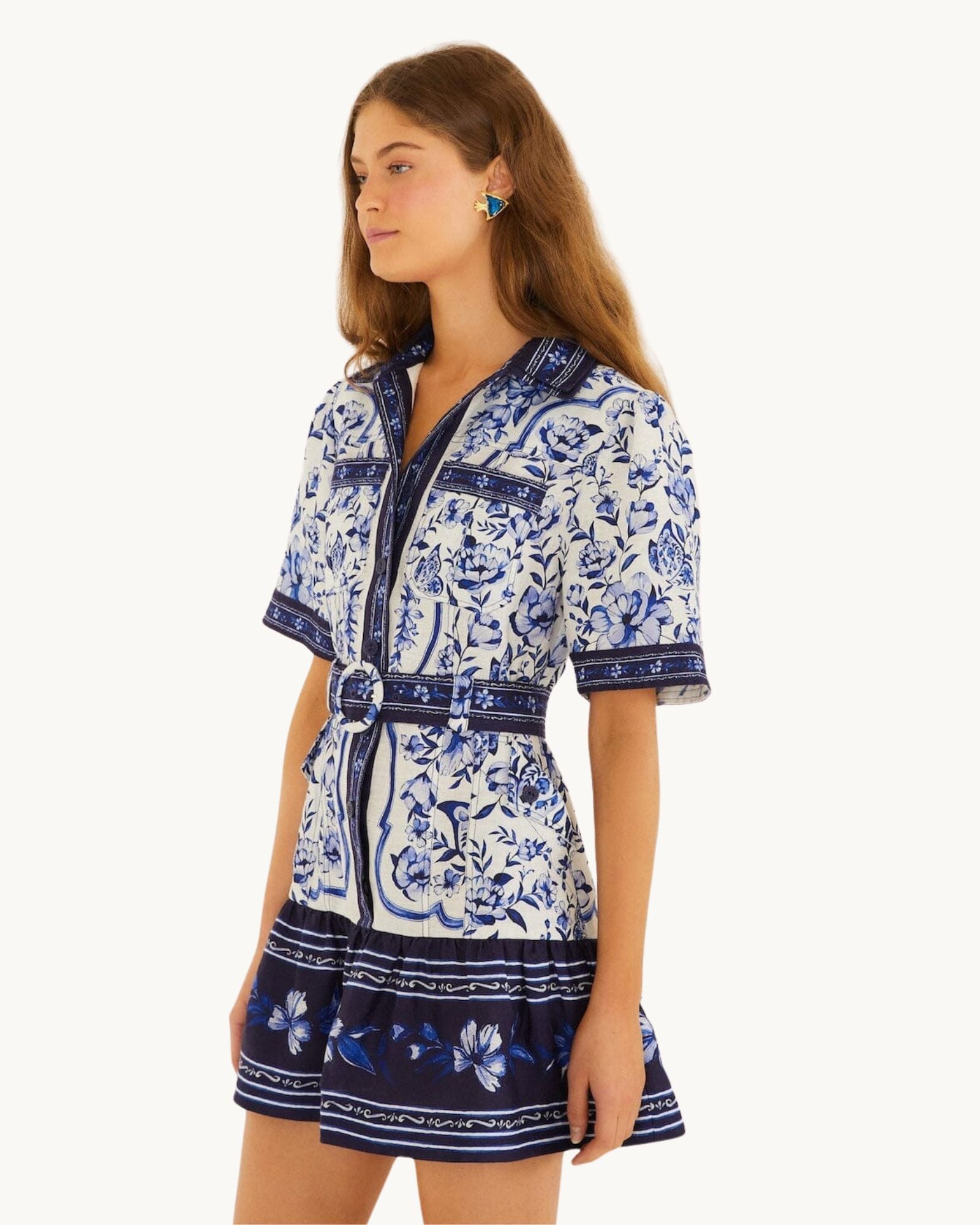 Side view of the FARM Rio Blue Porcelain Garden mini shirt dress showing the relaxed short sleeves and belted waist