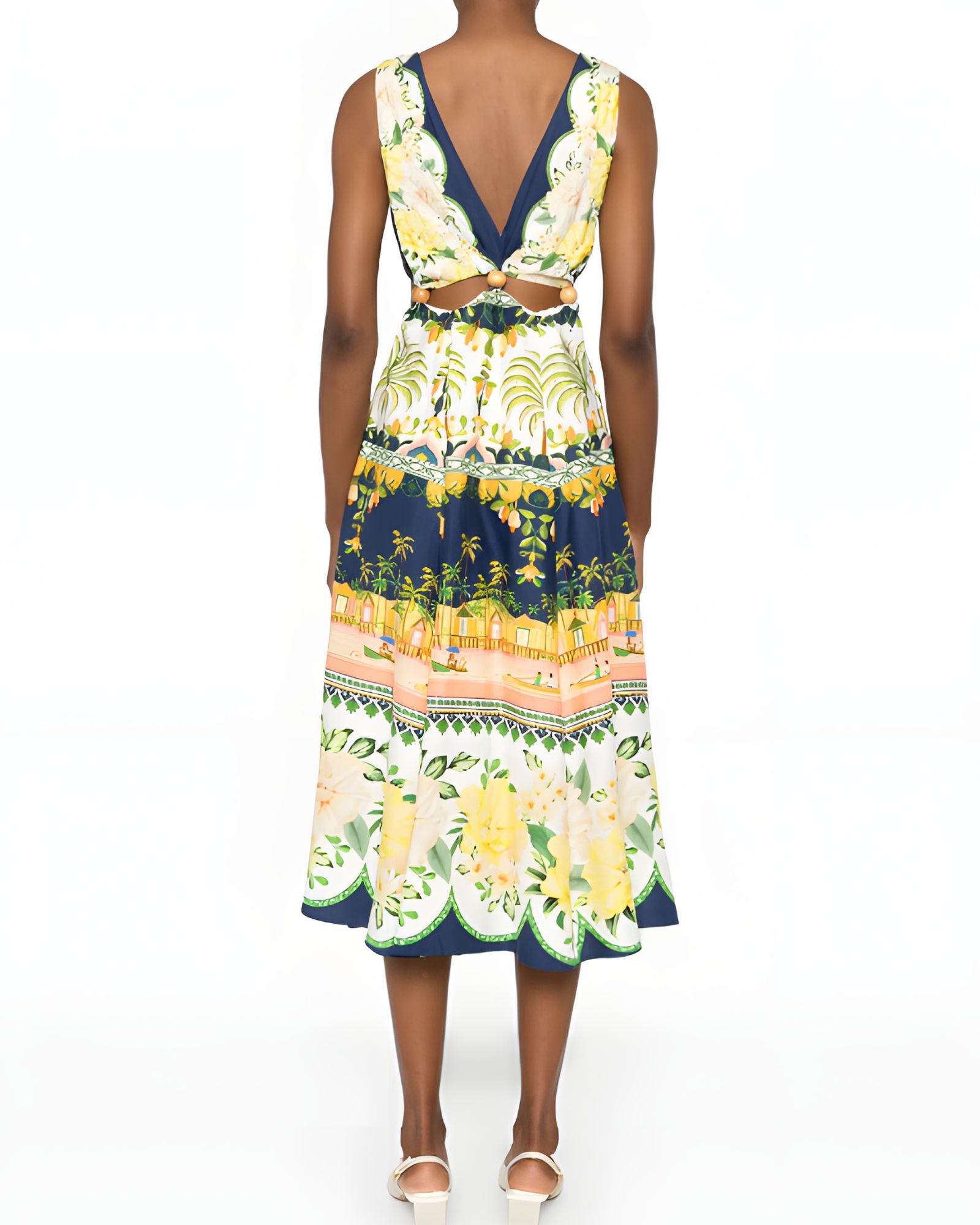 Rear studio view of a model wearing the Farm Rio embellished printed midi dress, highlighting the elegant open-back design and sleeveless cut.
