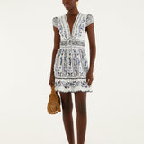 Farm Rio Flowers Arch ruffled mini dress in off-white cotton with flutter sleeves, front view