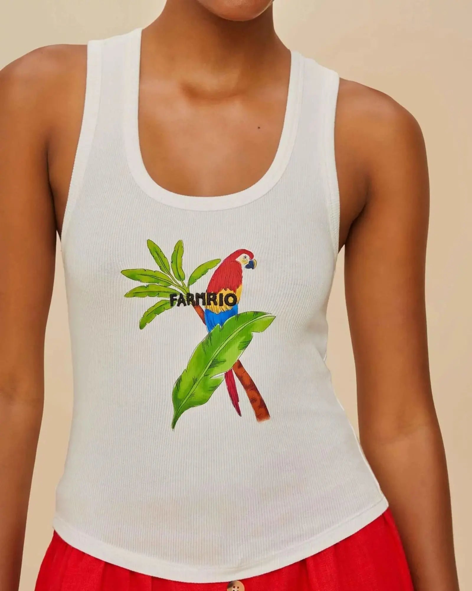 White tank top with a colorful parrot design and 'Farm Rio' text