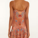 Back view of a model wearing the sleeveless FARM Rio mocha boho blouse with thin straps.