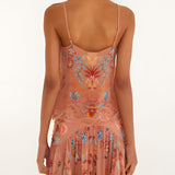 Back view of a model wearing the sleeveless FARM Rio mocha boho blouse with thin straps.