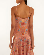 Back view of a model wearing the sleeveless Farm Rio mocha boho blouse with thin straps.