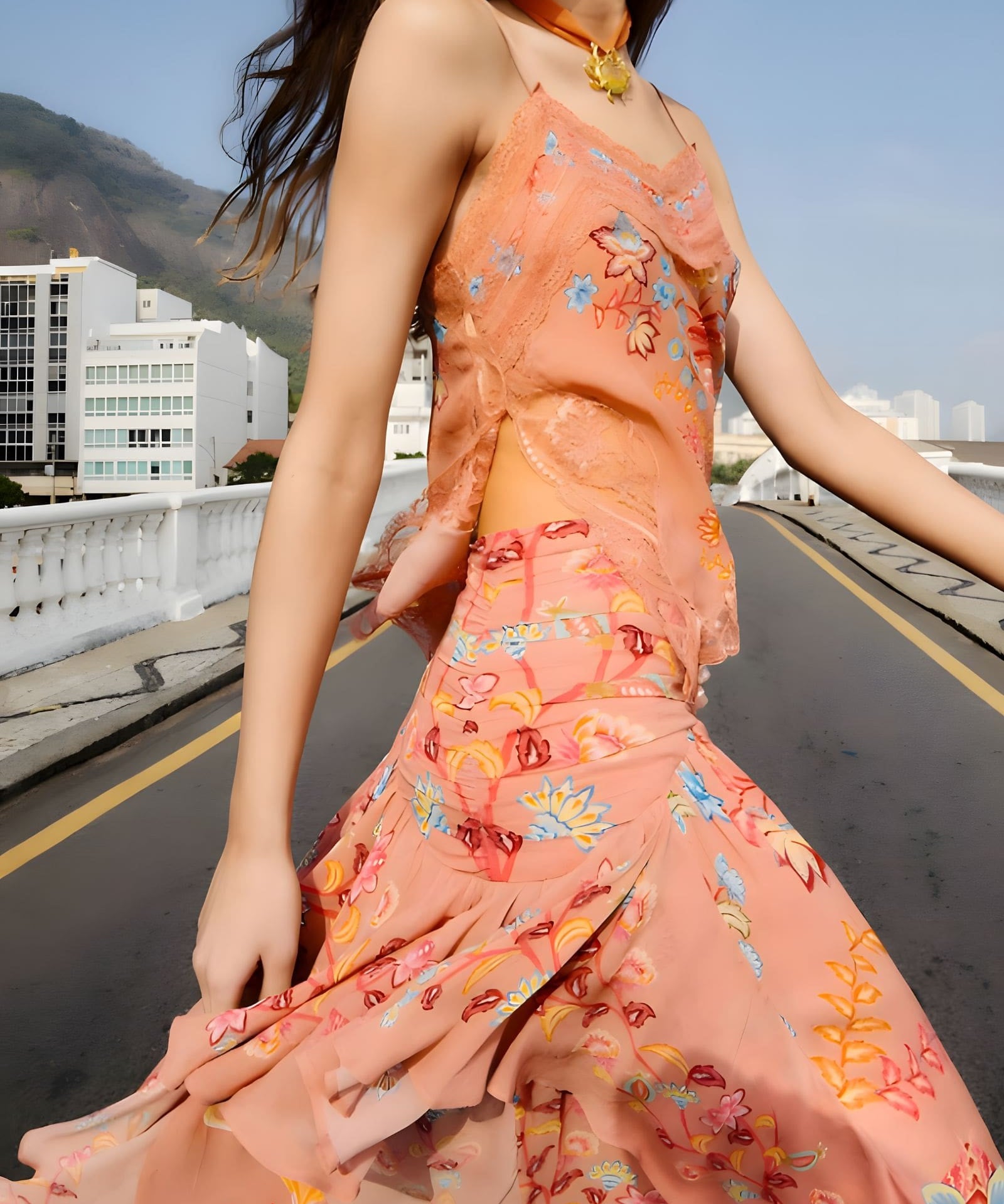 Side view of a model styling the sleeveless mocha Farm Rio lace blouse.