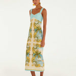 Side view of the FARM Rio Royal Sea maxi dress, showing the flowing full-length skirt