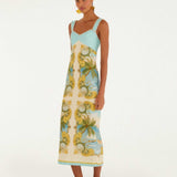 Side view of the FARM Rio Royal Sea maxi dress, showing the flowing full-length skirt