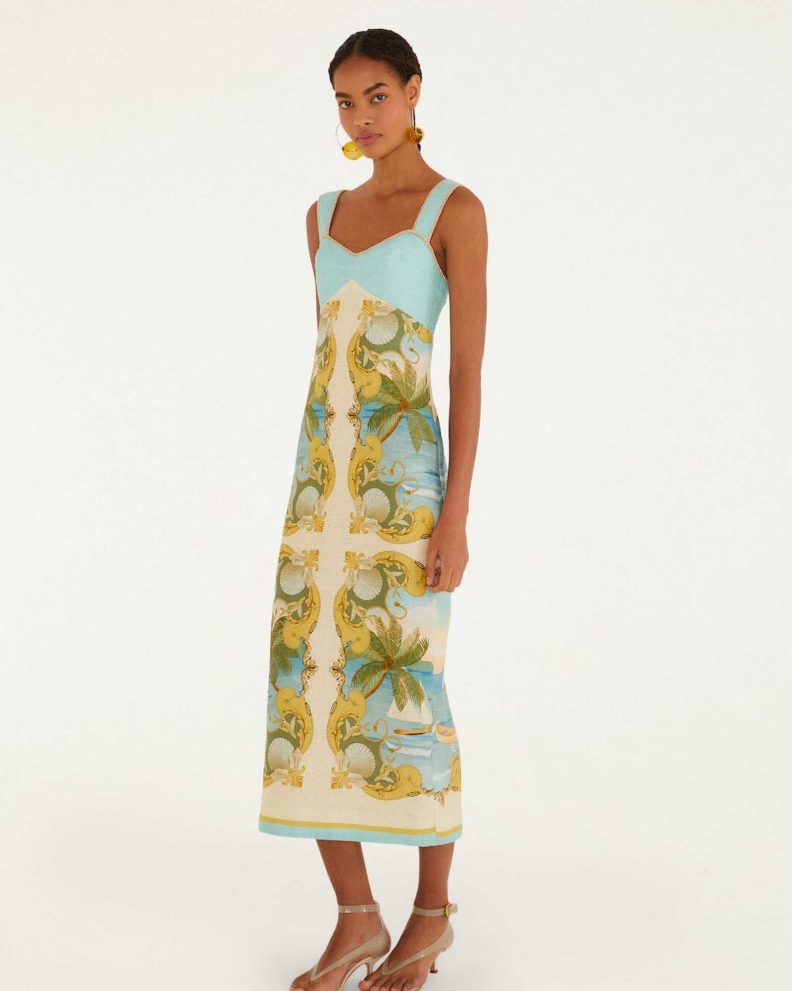 Side view of the FARM Rio Royal Sea maxi dress, showing the flowing full-length skirt