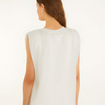 Back studio view of the Farm Rio off-white sleeveless t-shirt, showcasing the clean drape and structured padded shoulder silhouette.
