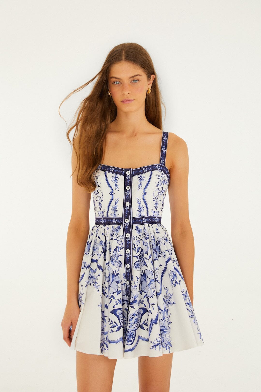 Model wearing FARM Rio off-white Porcelain Garden mini dress with hand-painted floral print, front view